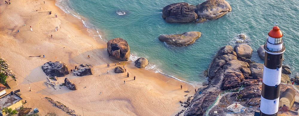 aerial view of a lighthouse and beach