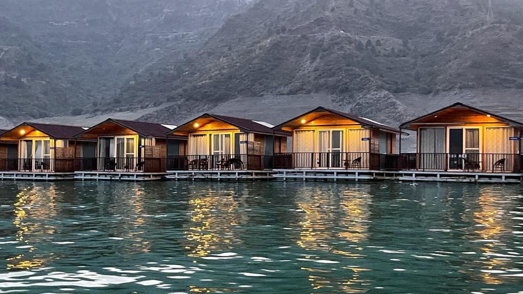 ariel and front view of the floating huts at Le ROI Floating Huts Eco Rooms captured during the day and at night10