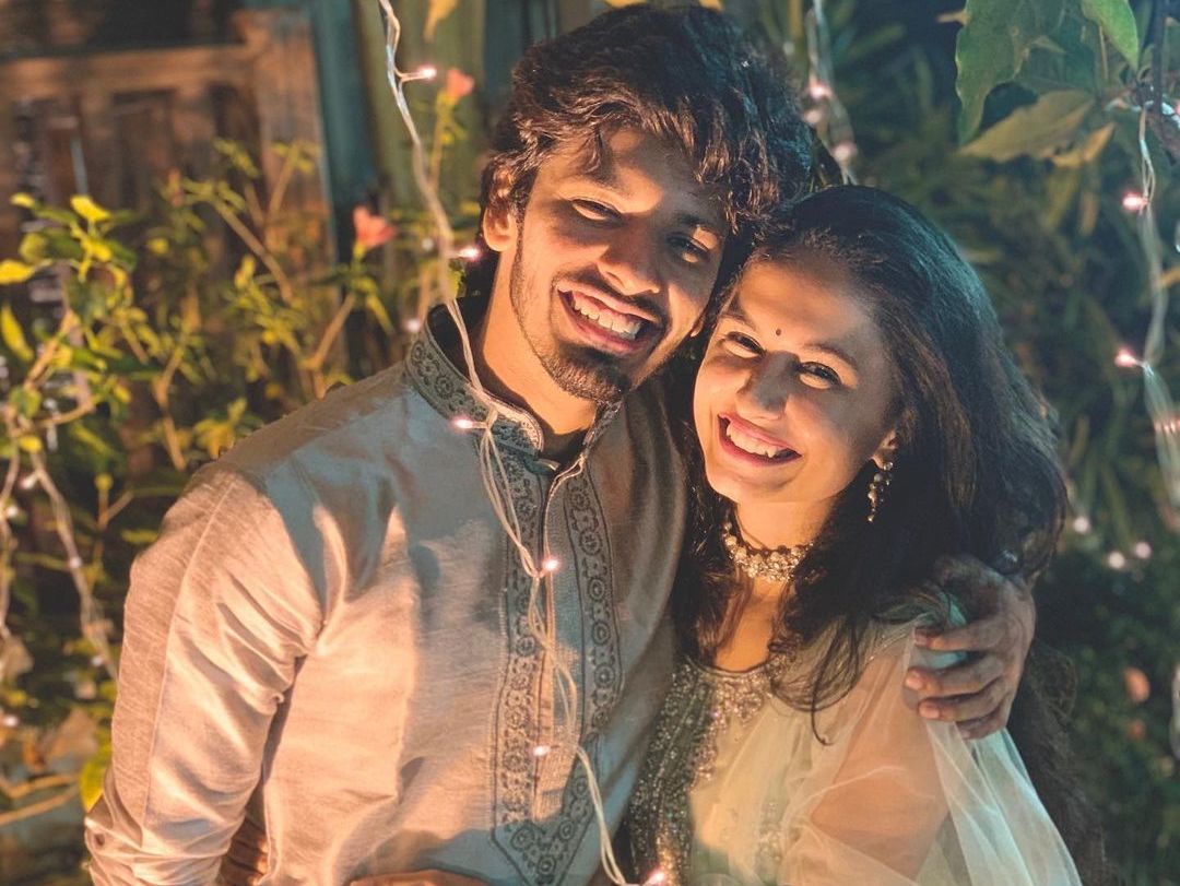 Happy couple in matching silver dress