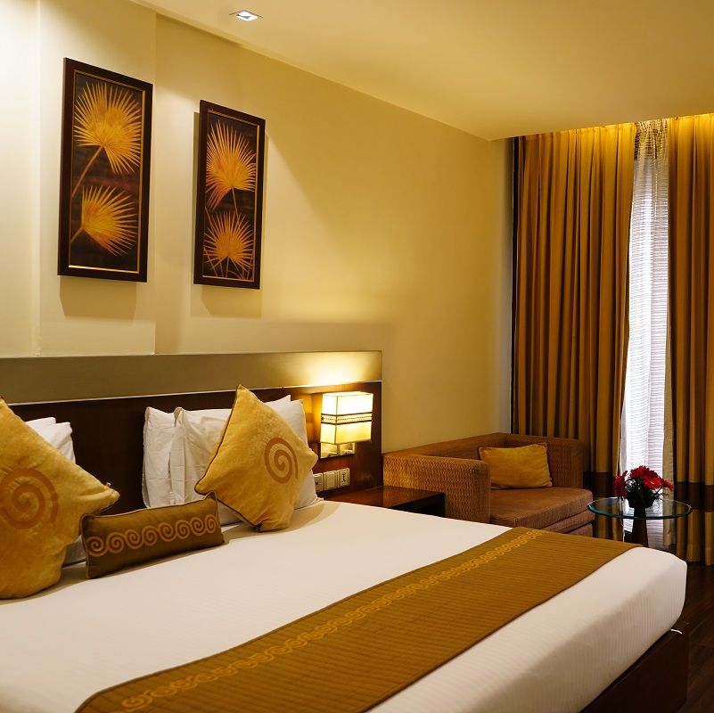 Club Room featuring a cosy bed and work desk at Shervani Nehru Place, New Delhi