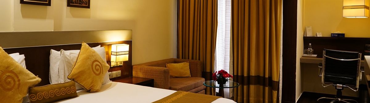 Club Room featuring a cosy bed and work desk at Shervani Nehru Place, New Delhi