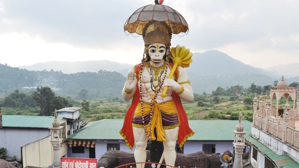 A huge statue of lord Hanuman Garhi with in between the temple