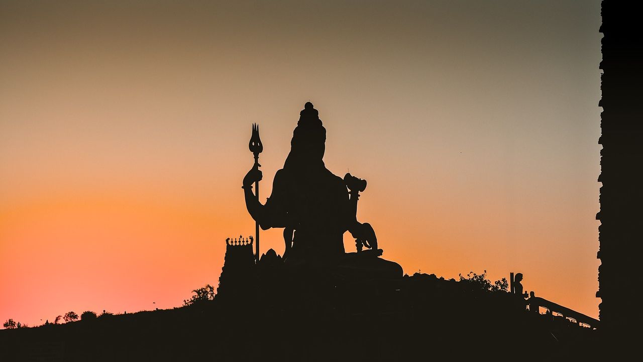 silhouette of a statue of shiva