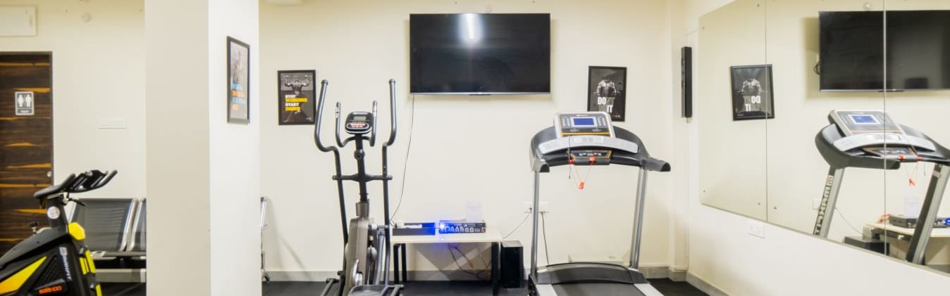 Image of the compact gym with treadmill.