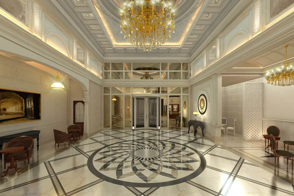 Overview of the Lobby with marbled floors and chandelier on the roof at Rhythm Gurugram