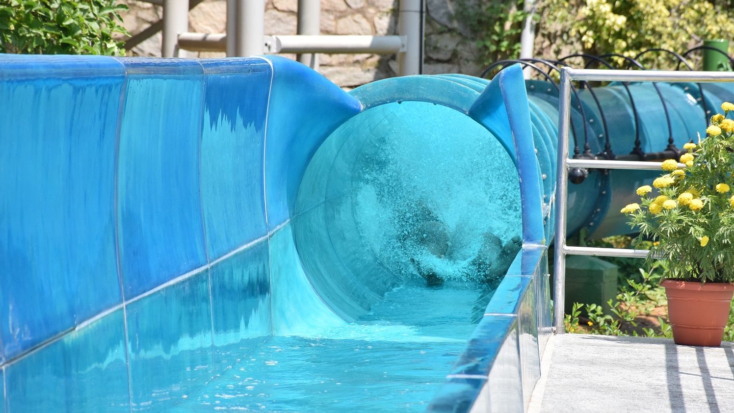 Blue tube filled with splashing water