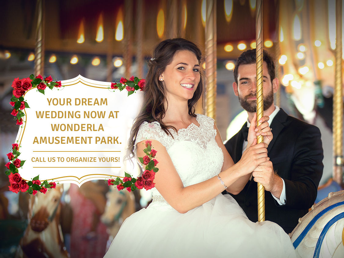 Wedded couple sitting on a ride  at Wonderla Resort