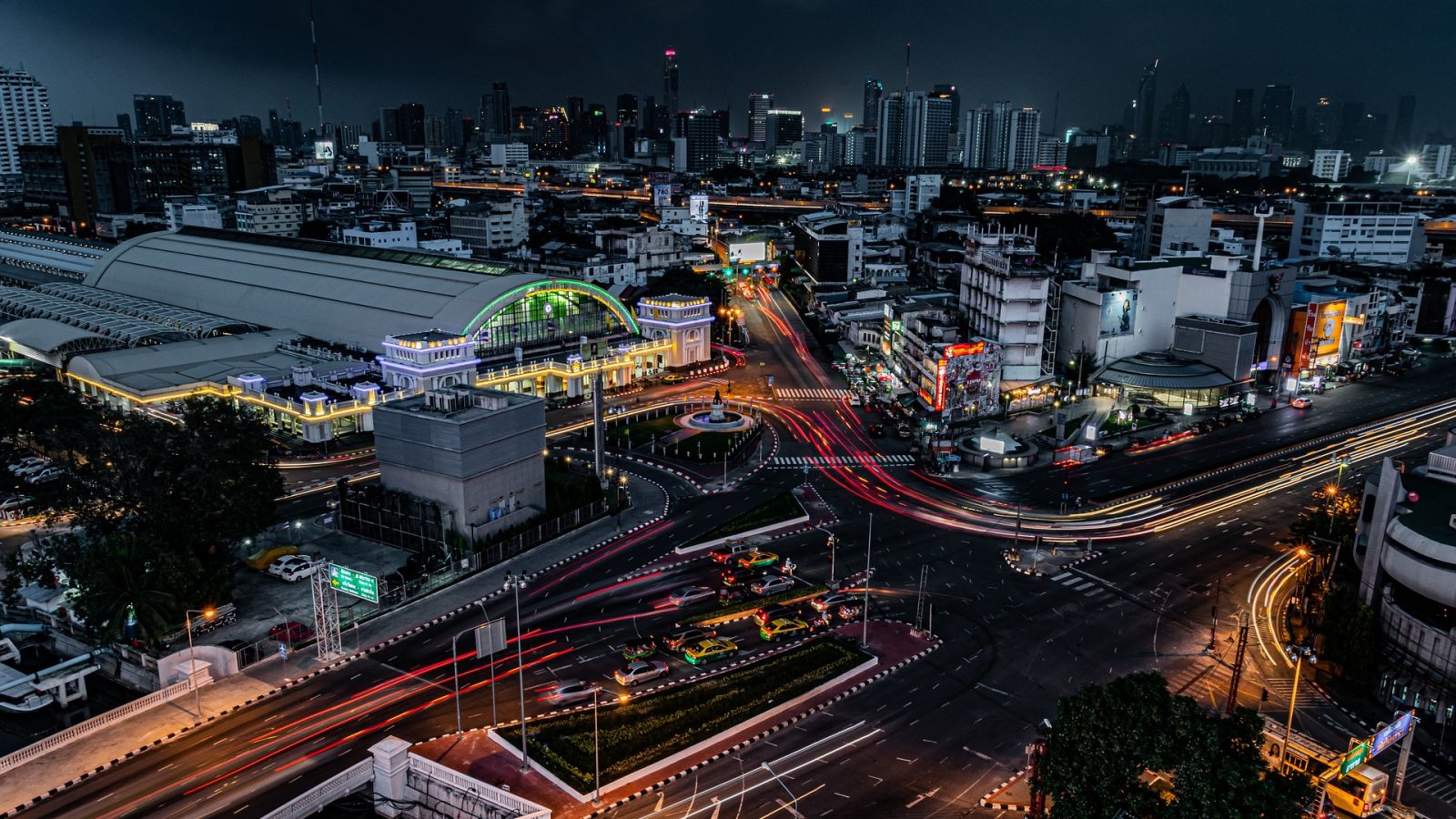 aerial view of Bangkok city at night with a long exposure on the cars going on the highway