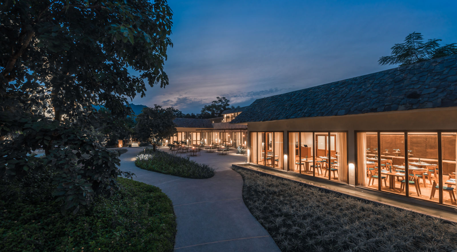 a well-lit restaurant at Saraca Corbett during the night