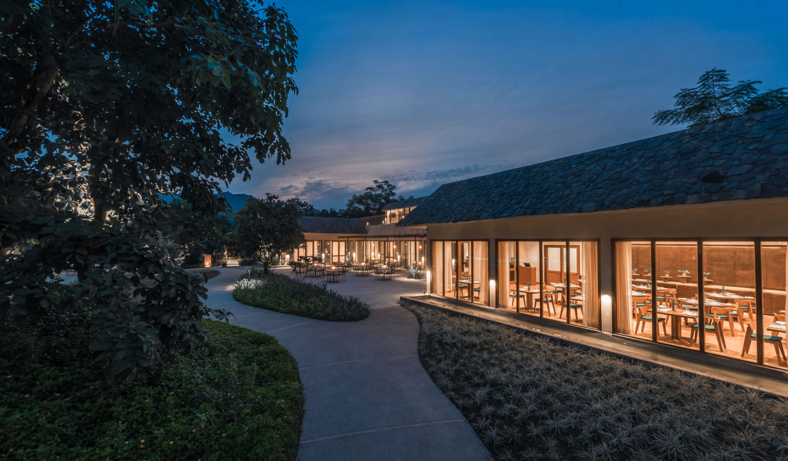 a well-lit restaurant at Saraca Corbett during the night