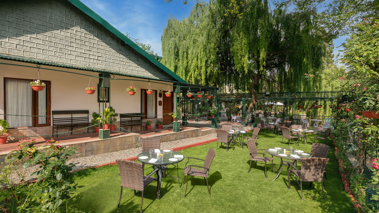 An outdoor area with lush green surrounding with mountains at Nainital Hilltop Nainital 