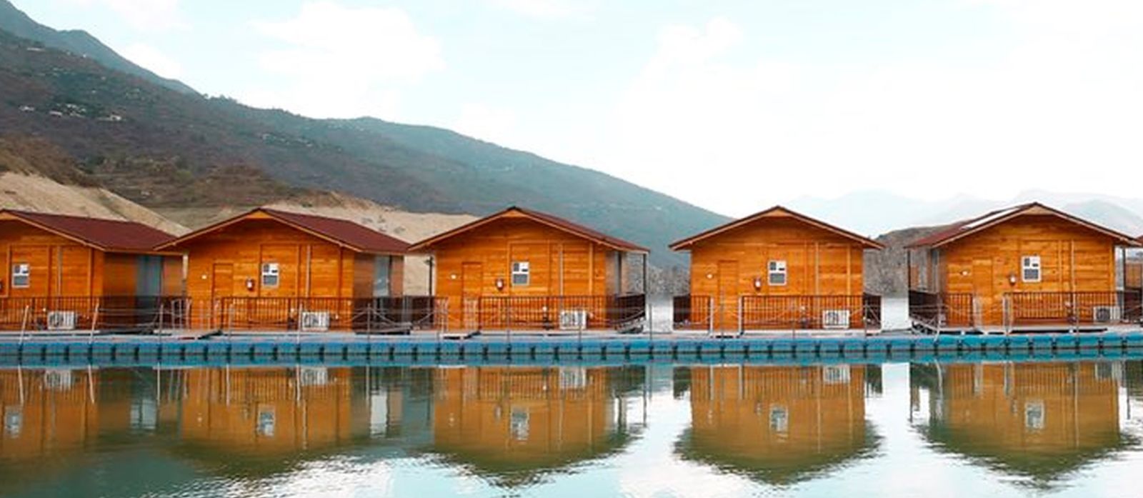 ariel and front view of the floating huts at Le ROI Floating Huts Eco Rooms captured during the day and at night11