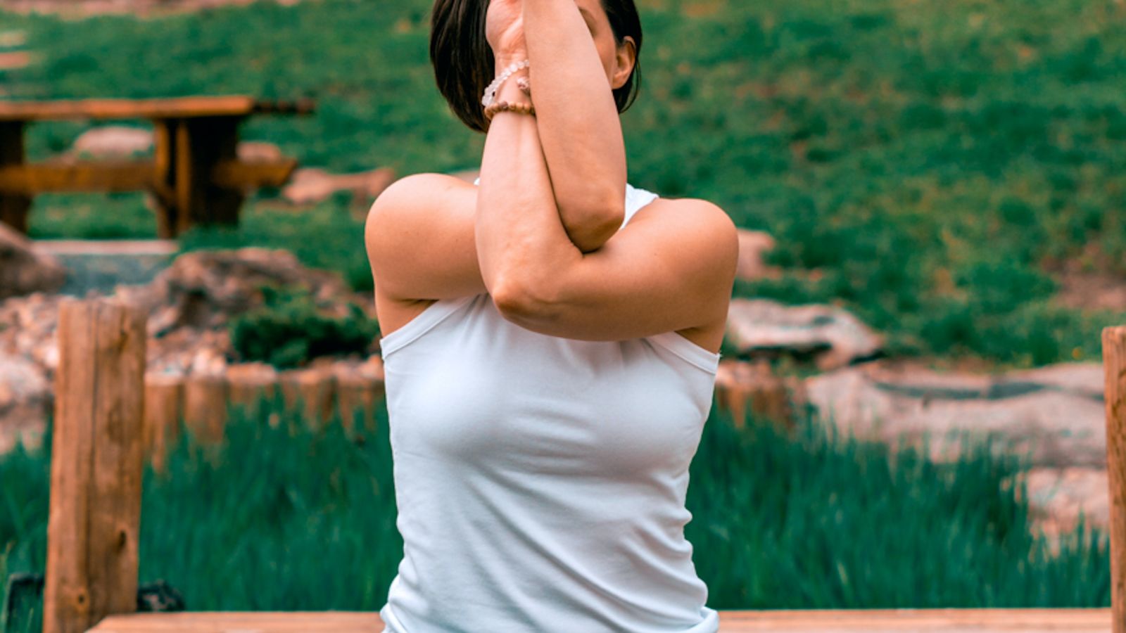 a woman in a yoga pose during daytime