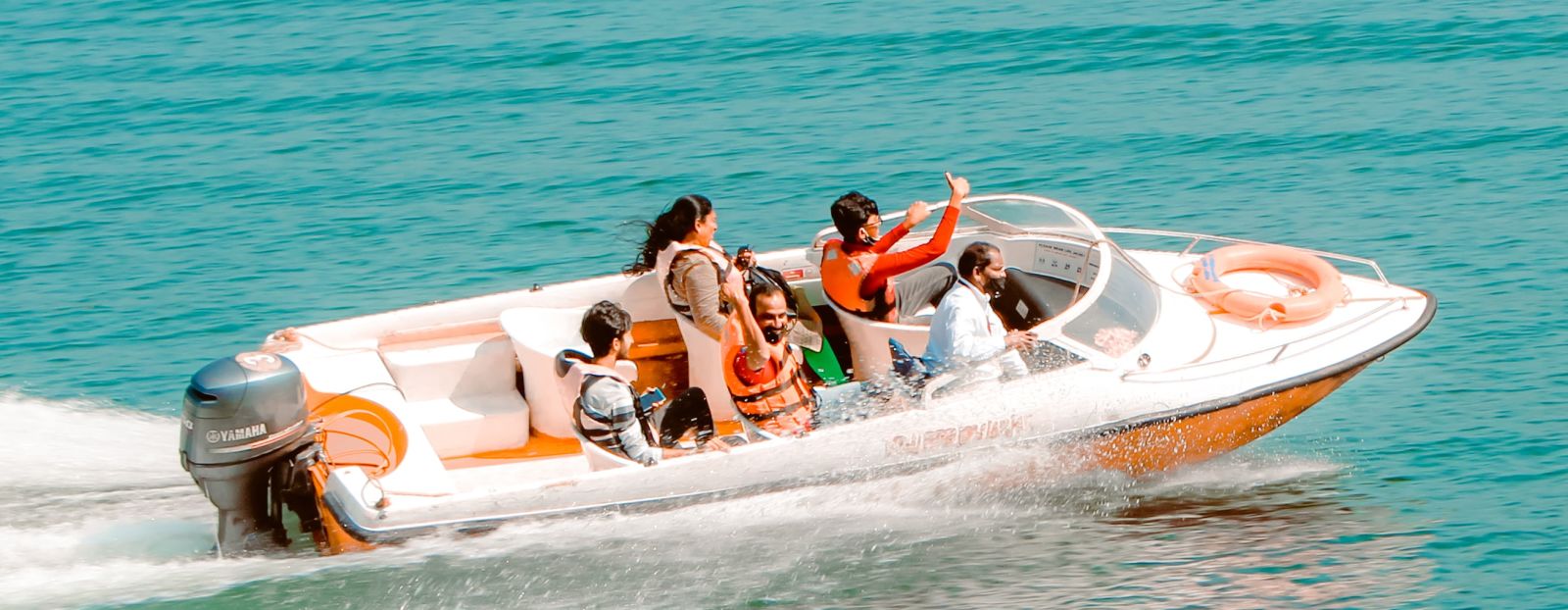 a family enjoying a speedboat ride