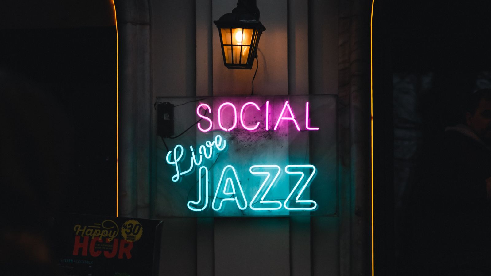 a neon sign outside a jazz club