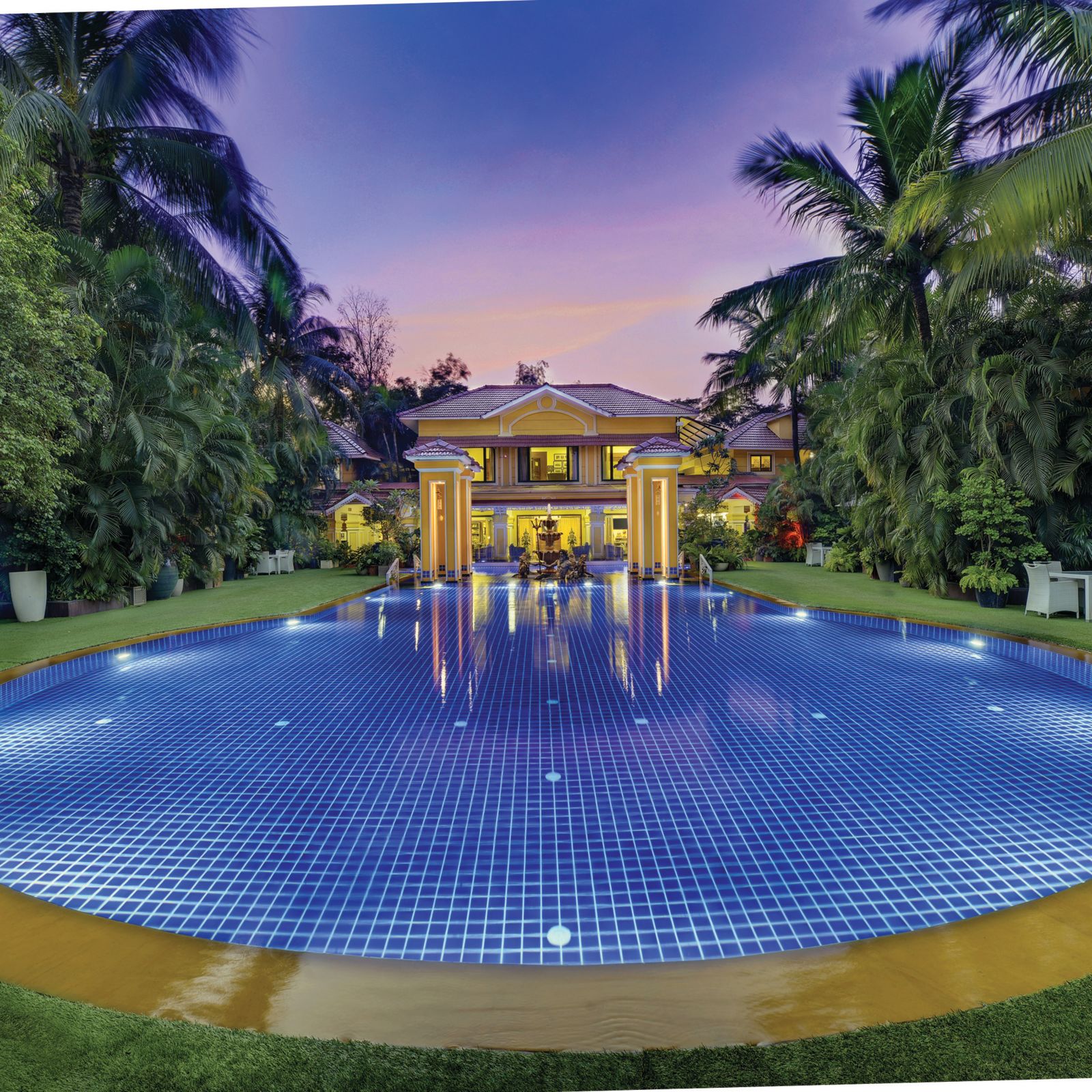 view of the swimming pool and the property behind it - Mayfair Lagoon, Bhubaneswar