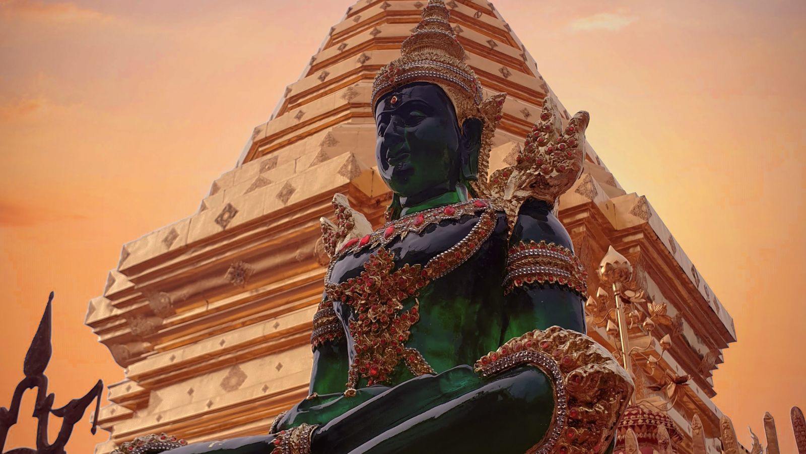 An emerald buddha s statue in front of the temple