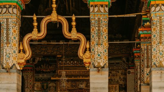 elderly woman sitting outside temple - Southern Grand Kashi