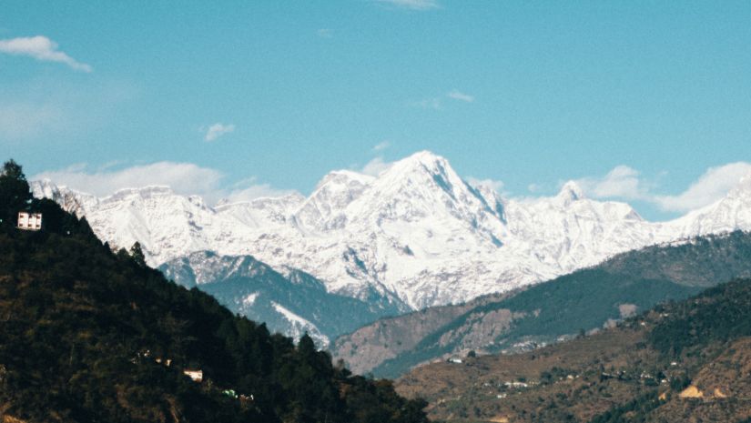 Aerial view of a strem flowing between the hills 