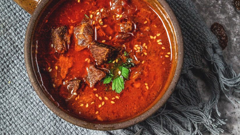 Red mutton curry sprinkled with flax seeds