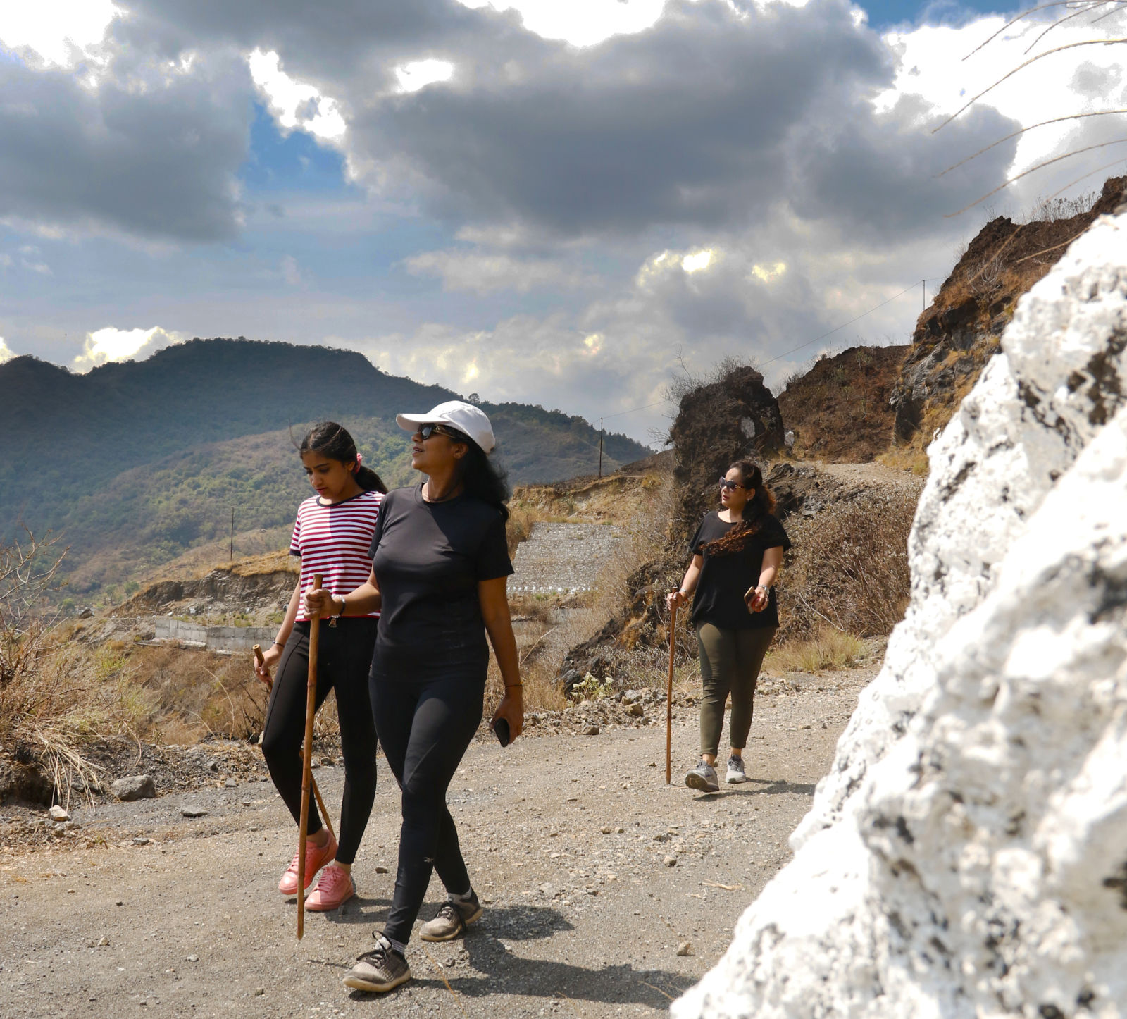 people on a trek on a mountain trail