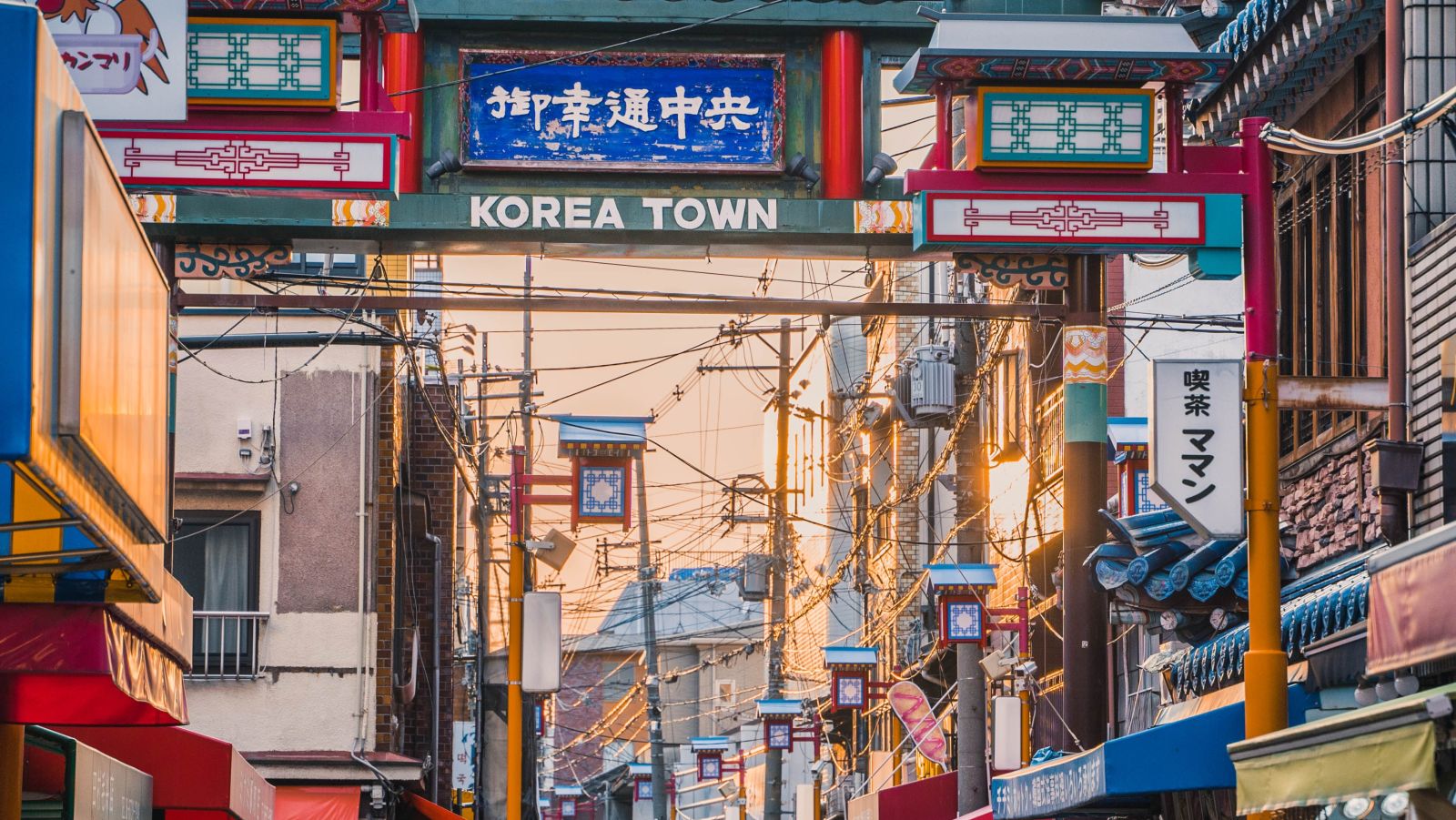 people walking to the entrance of Korea Town