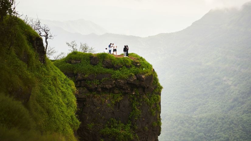 People standing on a hill in Matheran to see the lush views of this picturesque valley -Fort JadhavGADH 