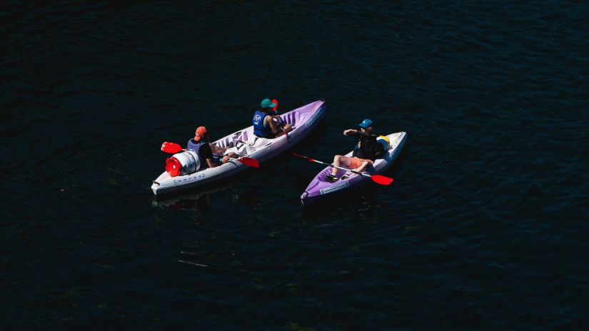 Two kayaks float away in the night - Night Kayaking Havelock