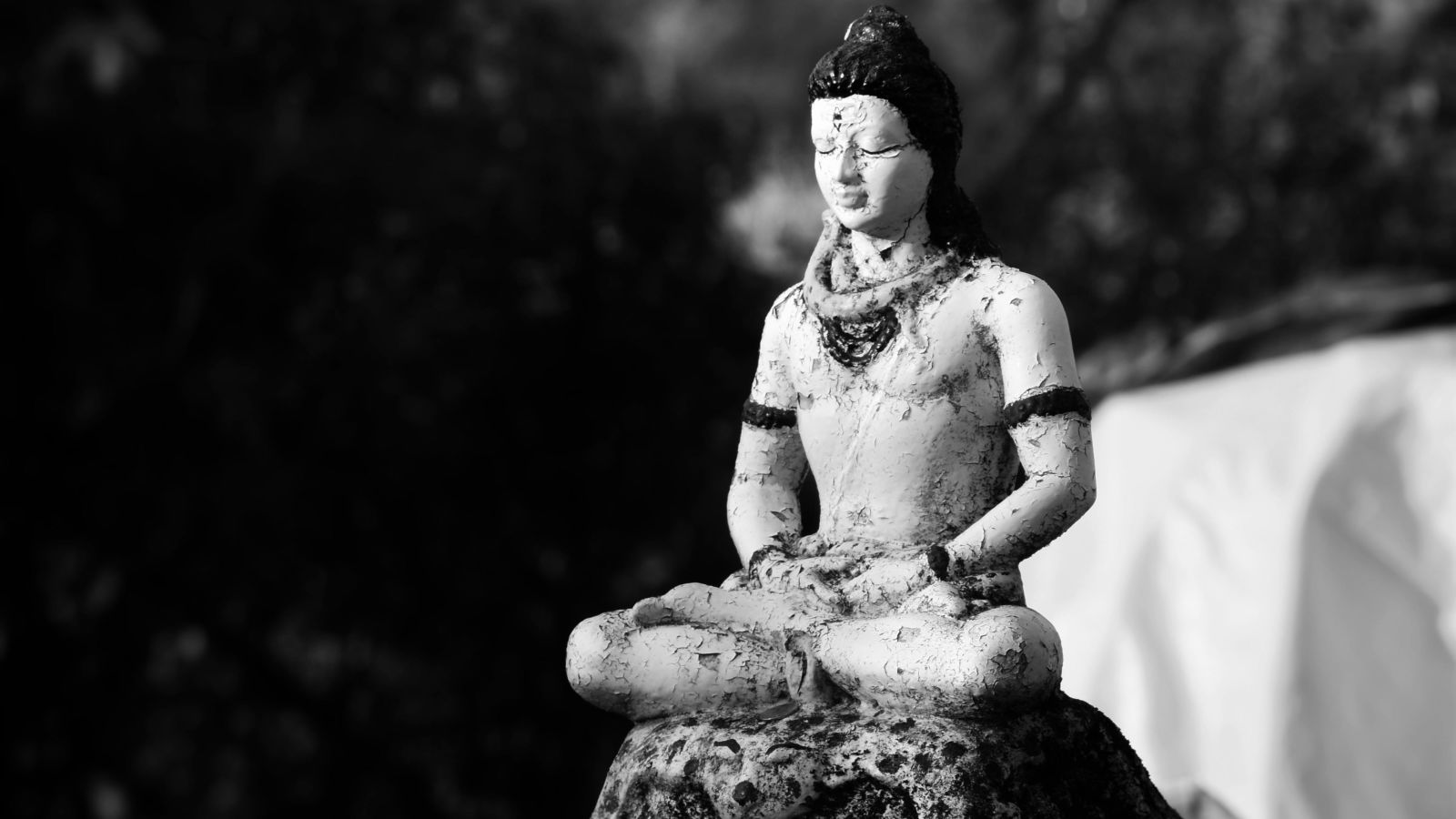 Grayscale photography of an old statue.