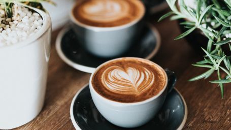 two coffee cups on a table