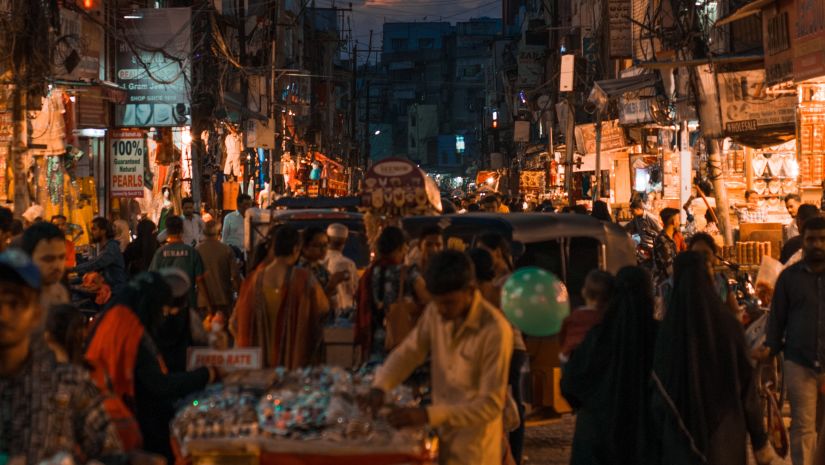 an overview of a bazaar with different hues in the sky in the background