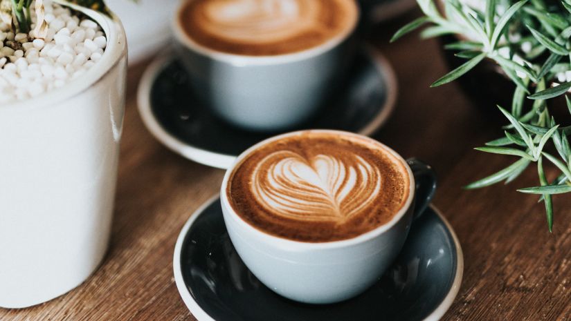 two coffee cups on a table