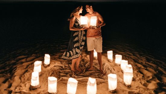 romantic candle light setting on the beach