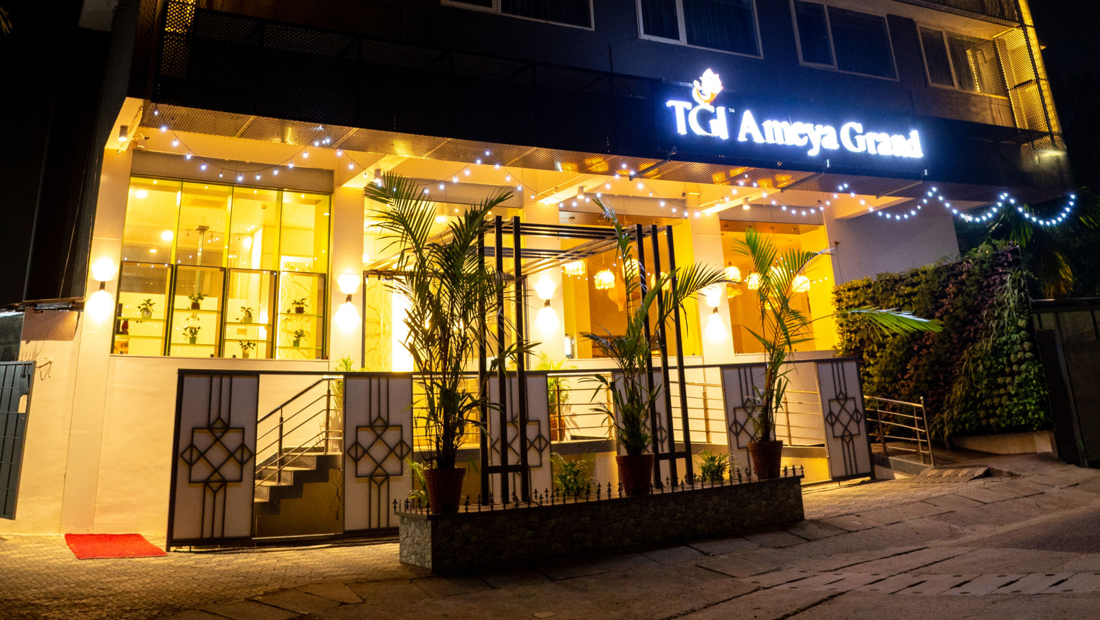 The TGI Ameya Grand hotel illuminated at night - TGI Ameya Grand, Goa