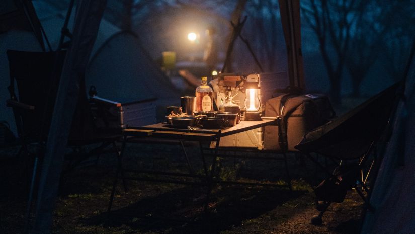 A dimly lit romantic dinner set up 