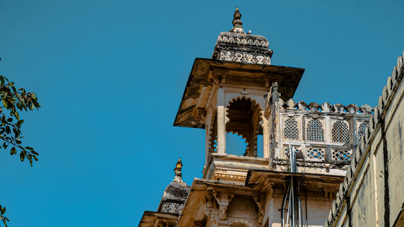 an ancient monument entrance, showcasing intricate architectural details and historical significance- Udaipur