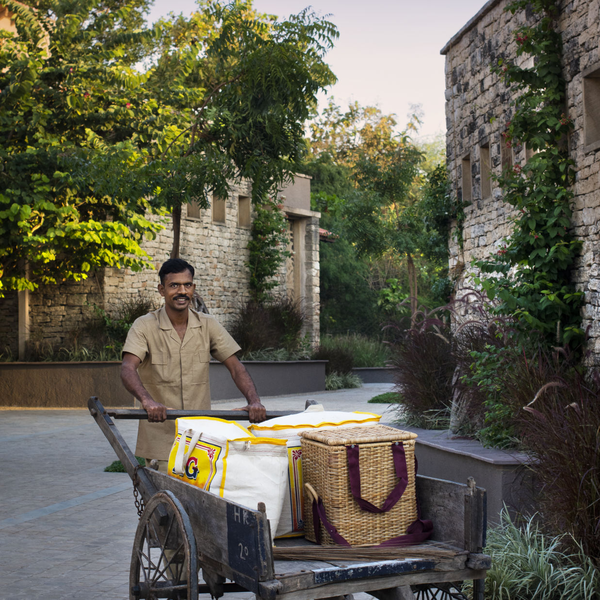 a man pushing a cart during daytime