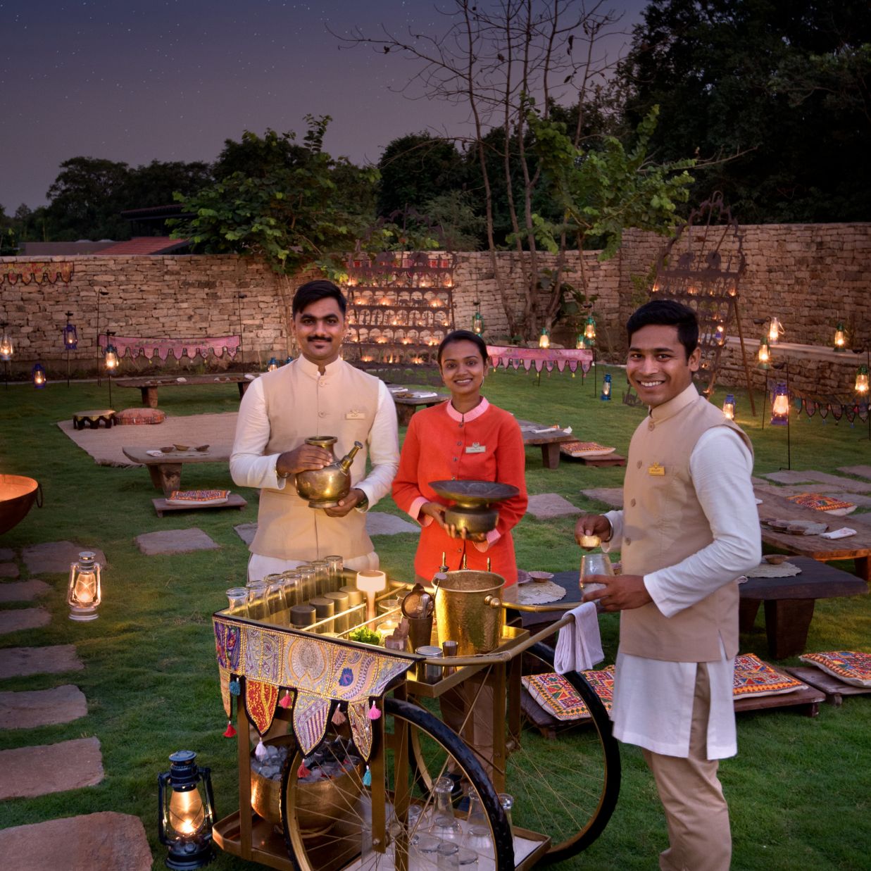 Staff of the Hotel Posing Whilst Working in the Garden