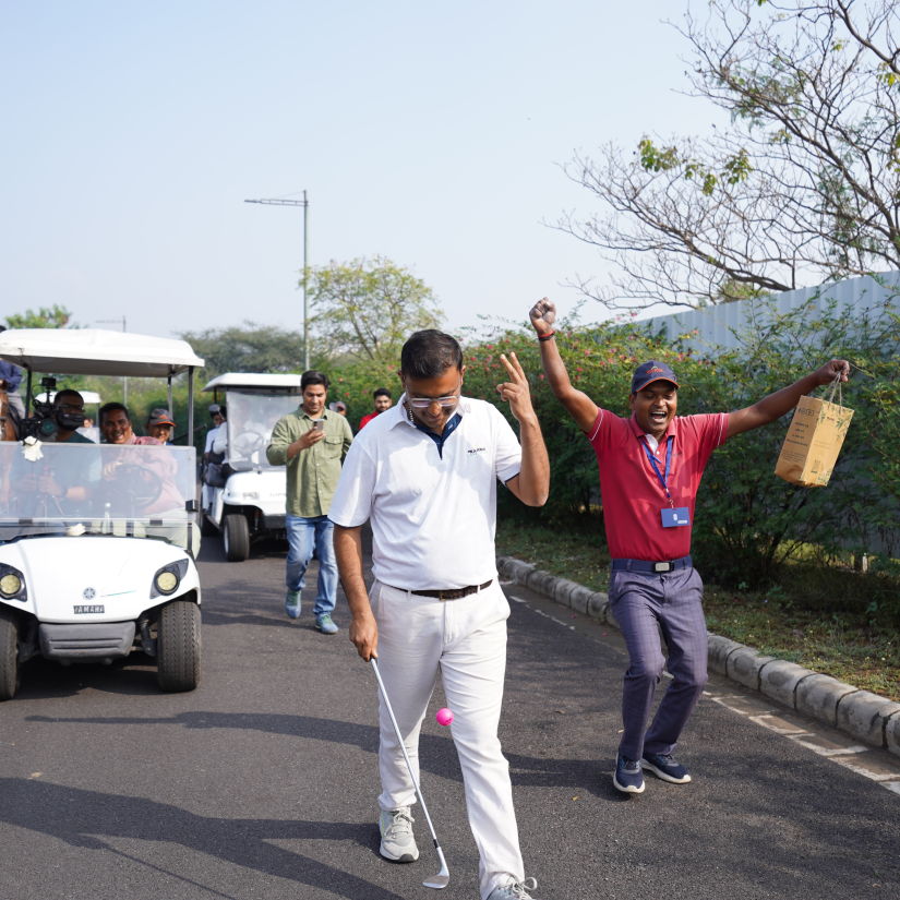 Anup Singh juggling a golf ball with his club - Karma Lakelands