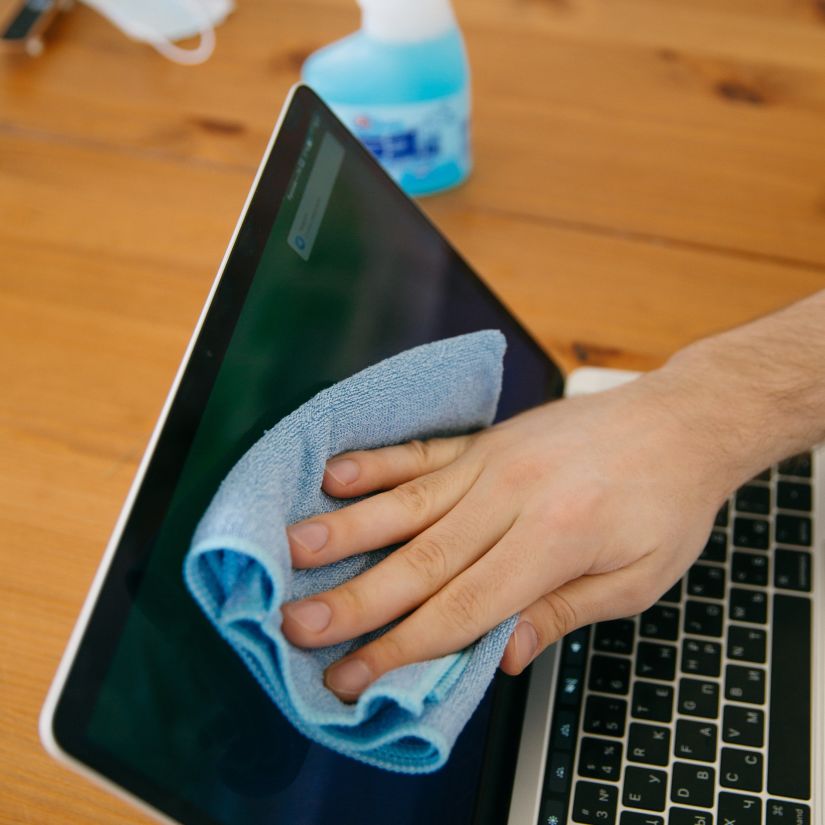 person-cleaning-the-laptop-4008564