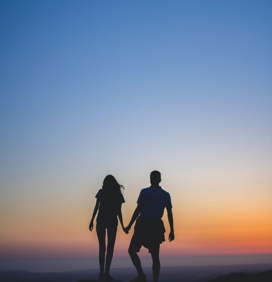 alt-text silhouette of a couple holding hands