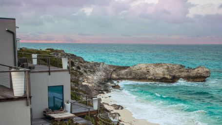 Villas near a beach with the blue sky in the background