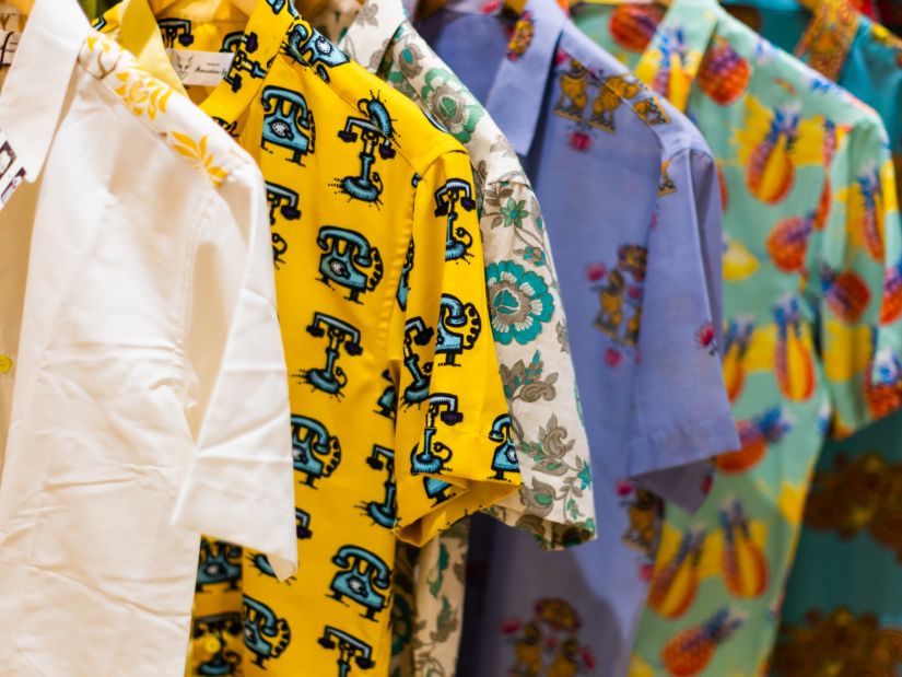 Heritage Village Goa - A display of multiple printed shirts hung placed on hangers in a line