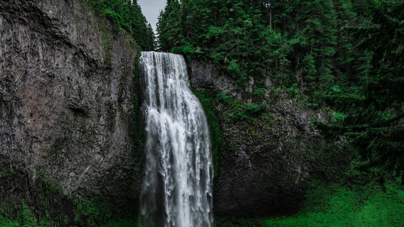 view of a waterfall cascading down rocks 1