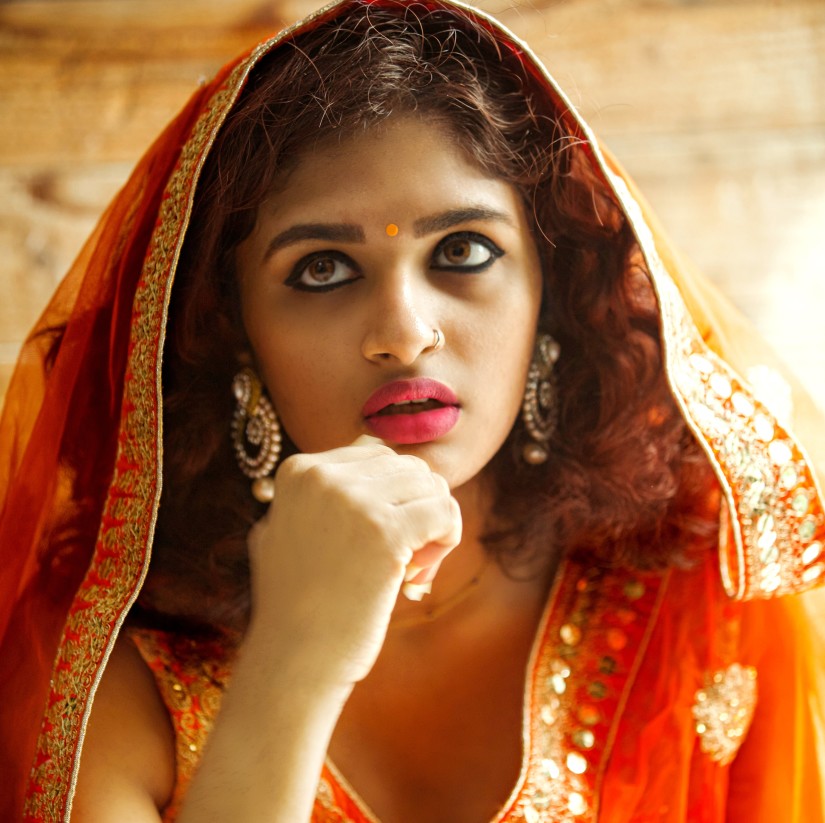 a bride dressed up in orange clothes