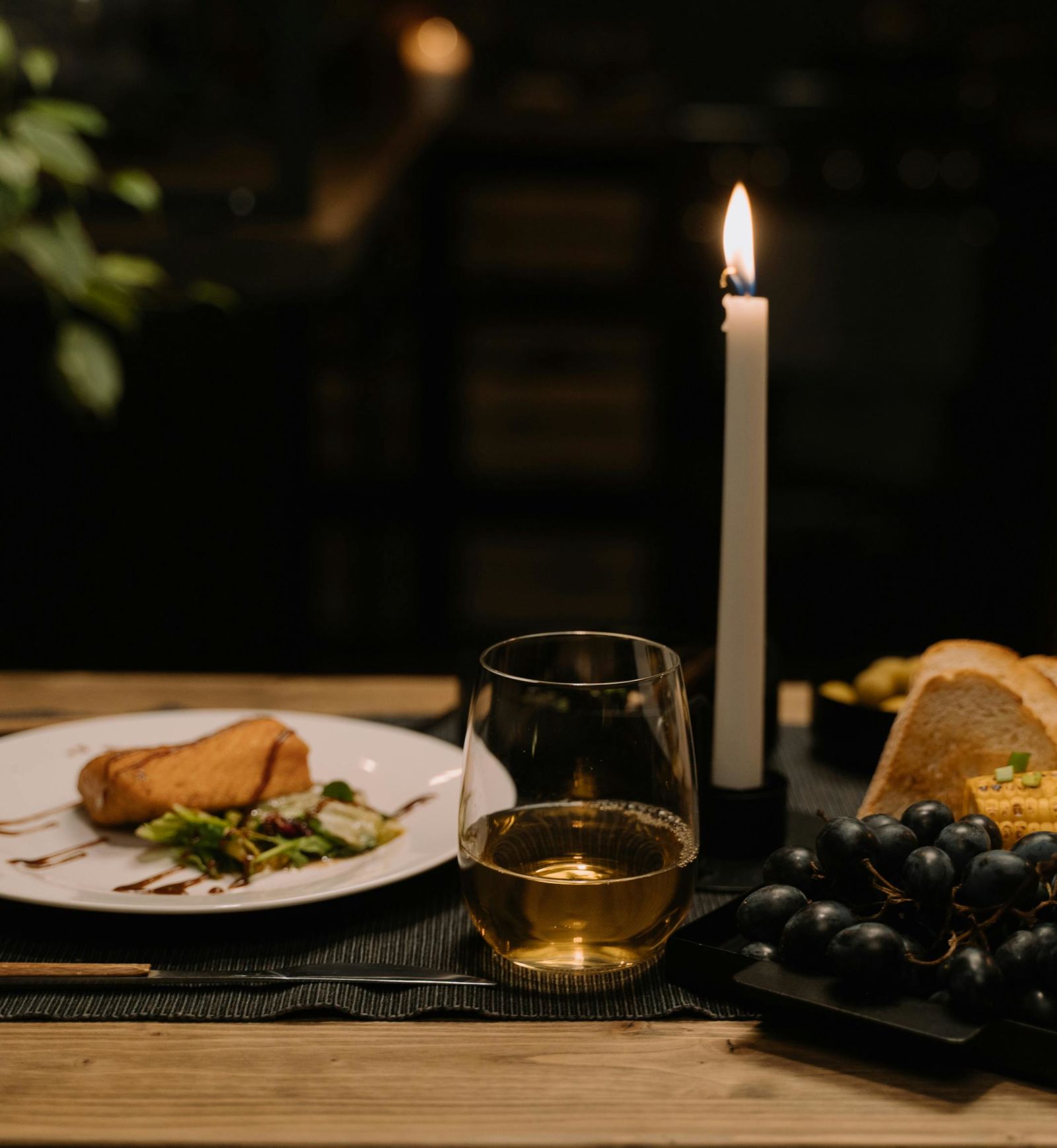 A table of food and fruits and candle 