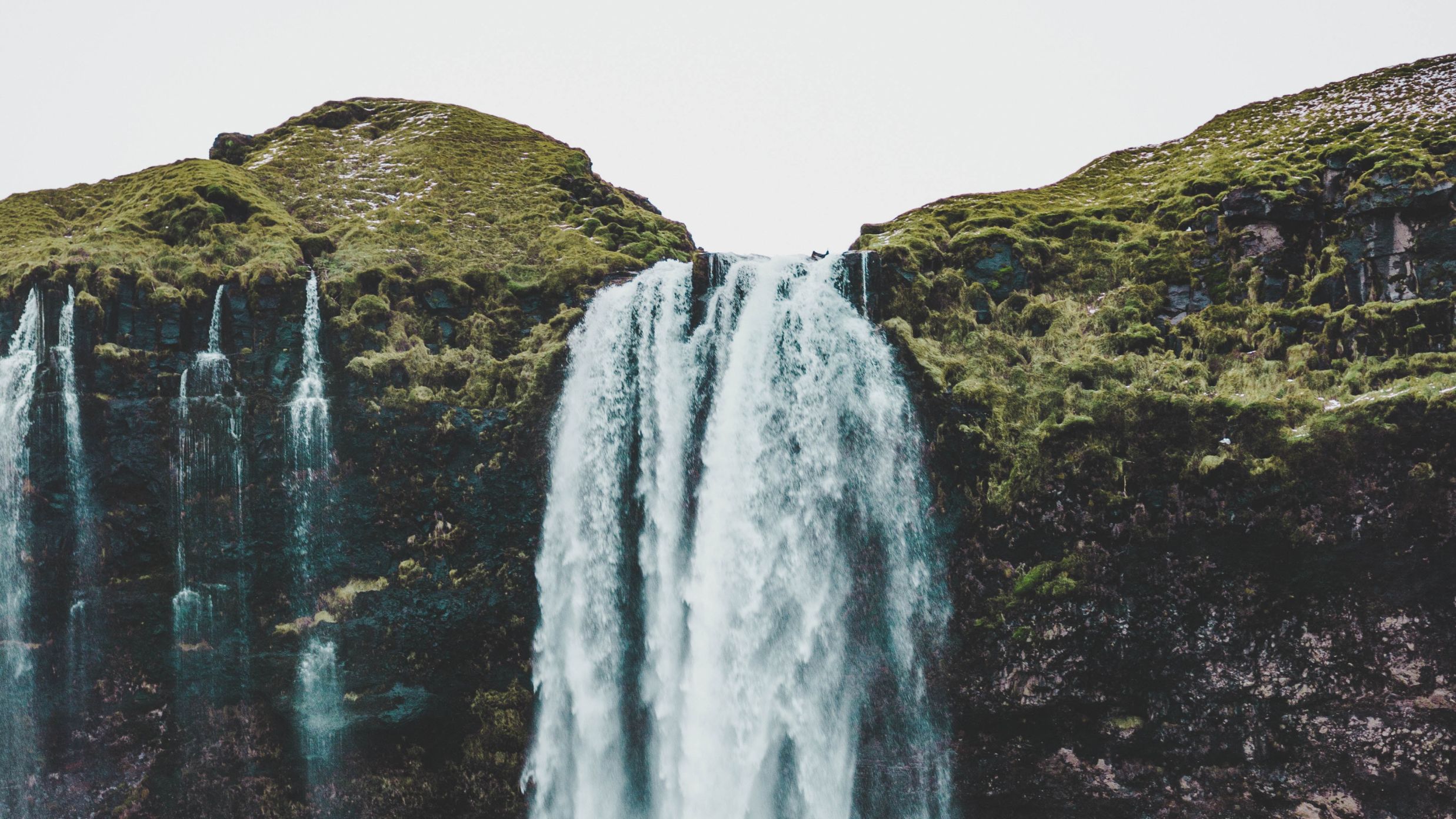 a waterfall cascading down a hill