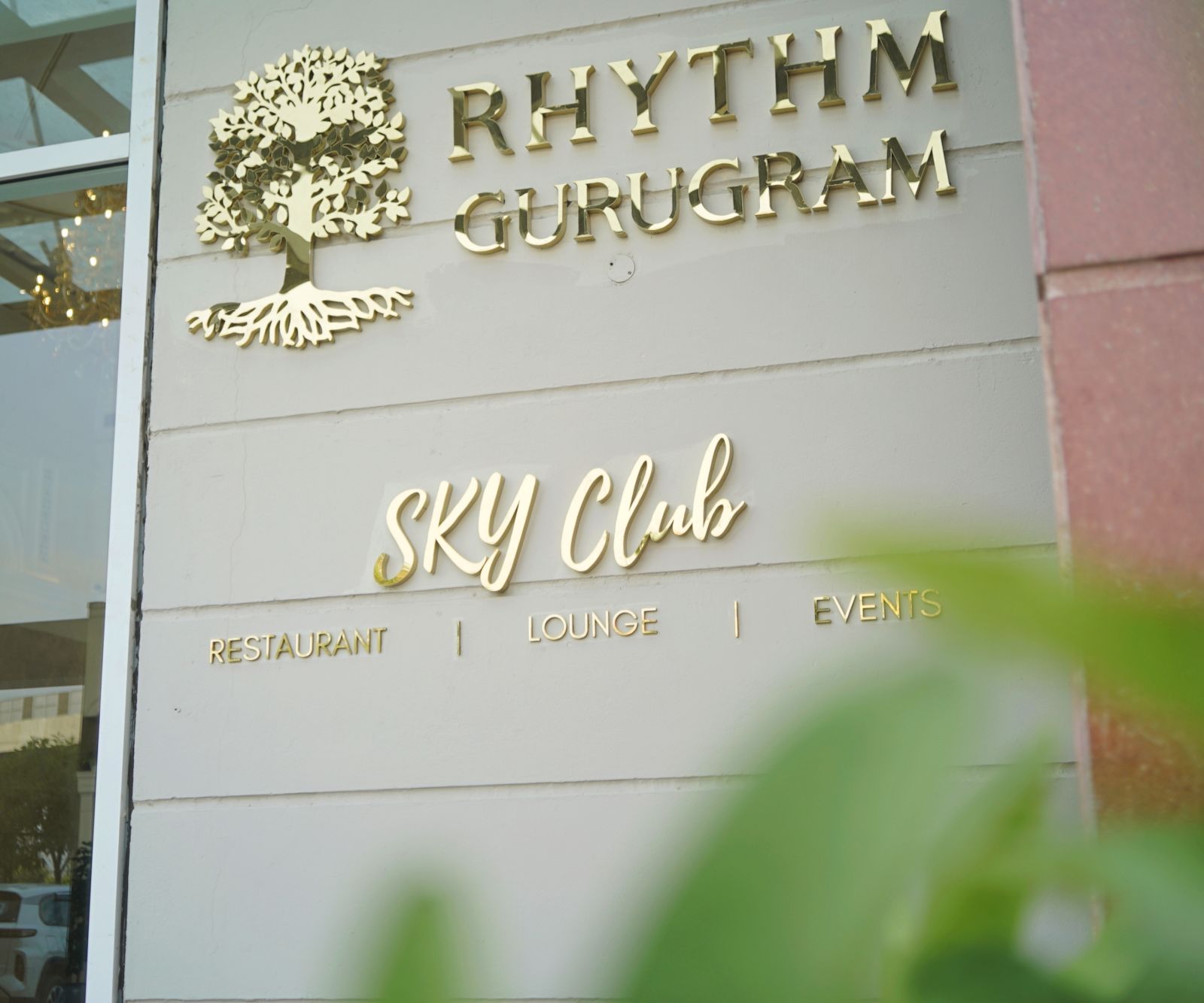 The signage of Rhythm Gurugram and SKY club at the entrance of the hotel