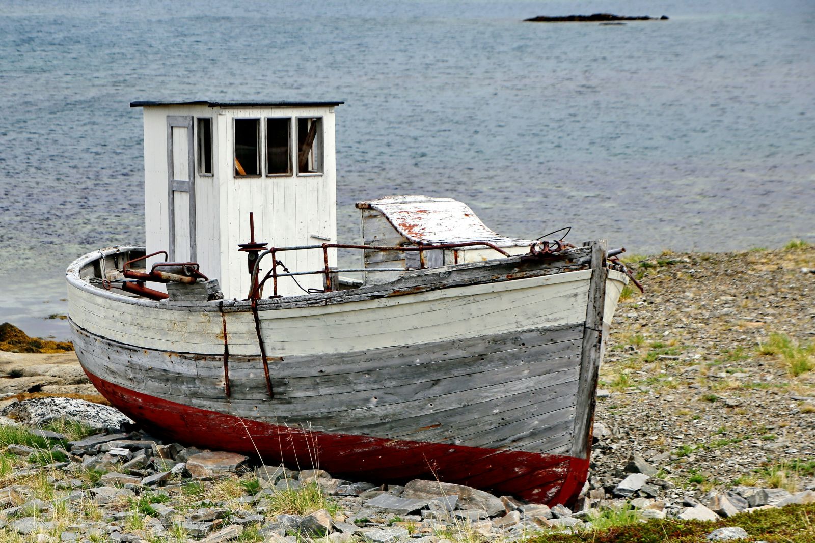 an old boat on a beach