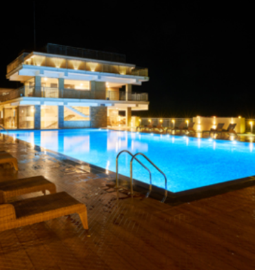 another angle of Night view of Swimming pool at Parakkat nature Hotel & resort, Munnar